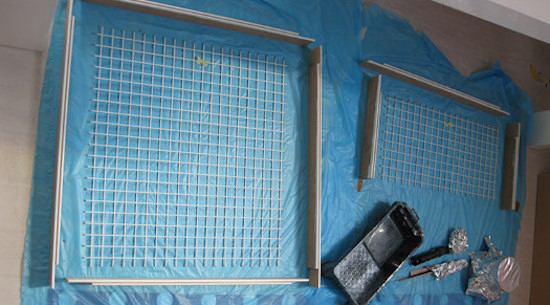 The door frame is made in sections with a groove in the edge for the mesh to sit in.